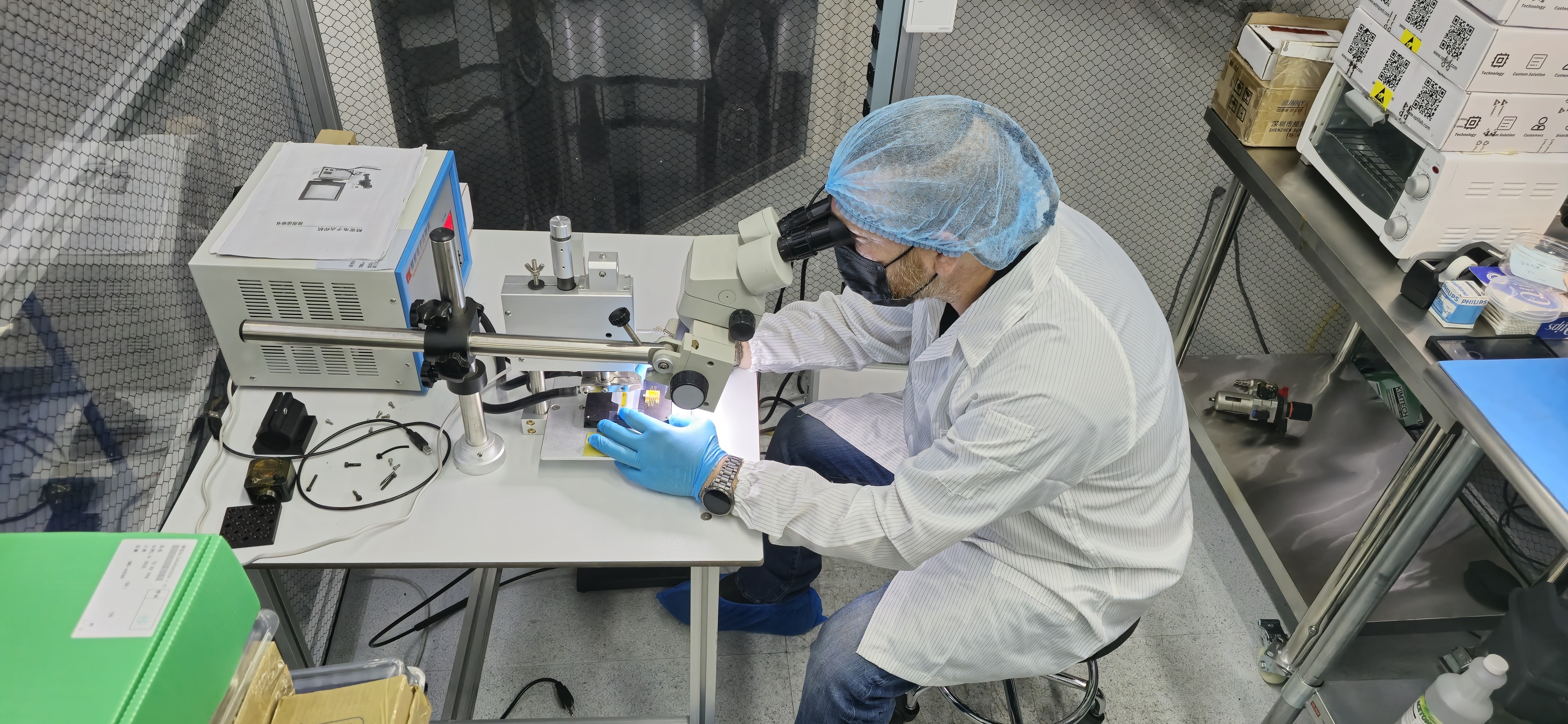 Engineer at microscope inspection station